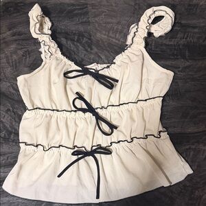 Chic Cream Ruffle Blouse with Black Trim